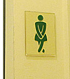 two photos show sillouettes of a boy and a girl with their legs crossed and hands both reaching down to their crotch.